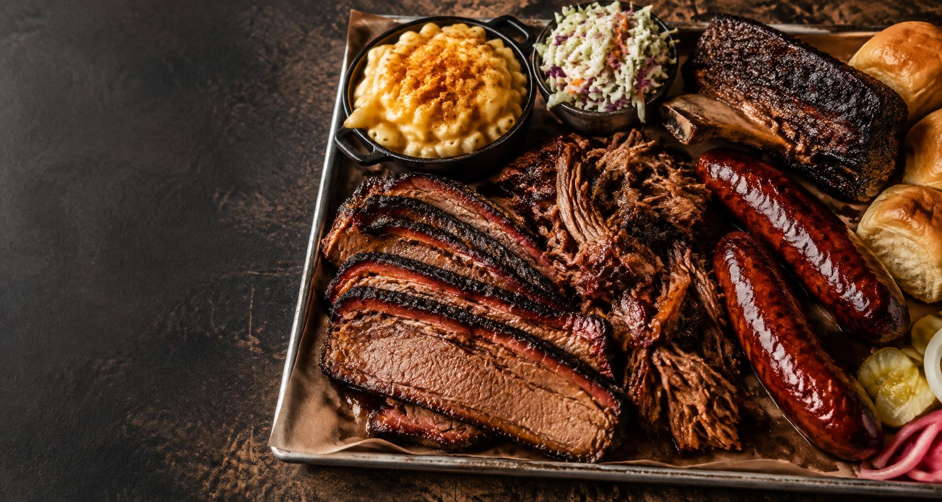 Texas-style smoked brisket, beef ribs, hot links, and classic BBQ sides